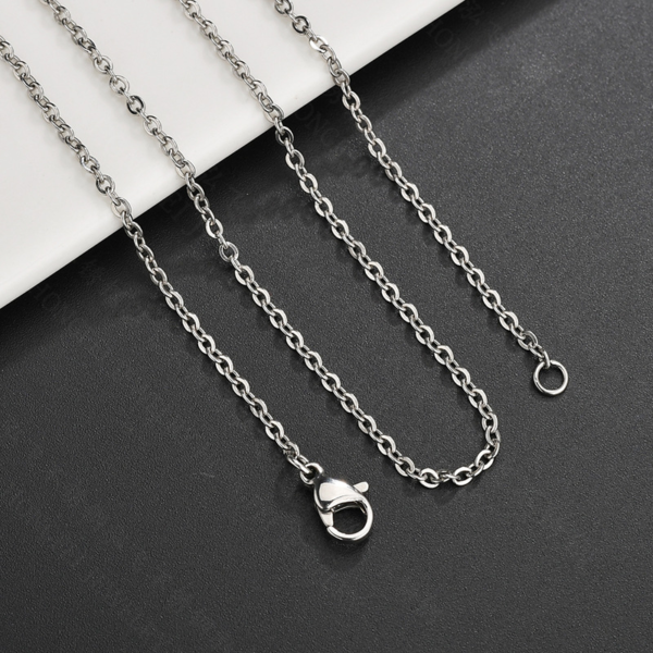 Detailed view of a high-quality finished silver stainless steel cable link chain necklace showing the lobster clasp and end ring mechanism.