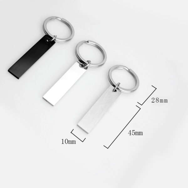 Technical dimensions of a flat rectangle metal bar keychain showing 45mm by 10mm pendant and 28mm key ring size for B2B supplier catalog.Can be used for laser engraving custom text.