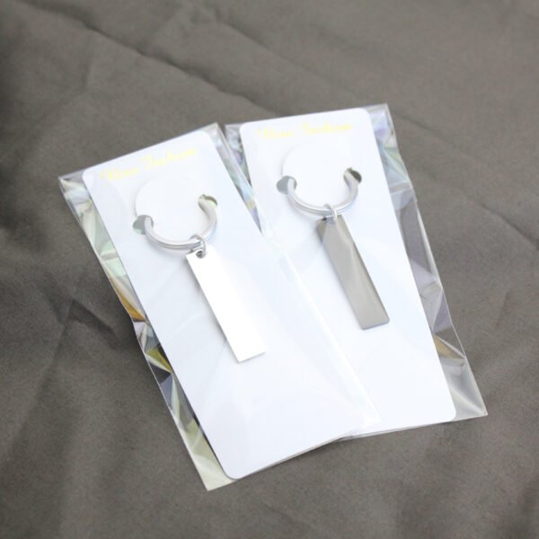 Technical dimensions of a flat rectangle metal bar keychain showing 45mm by 10mm pendant and 28mm key ring size for B2B supplier catalog.Can be used for laser engraving custom text.