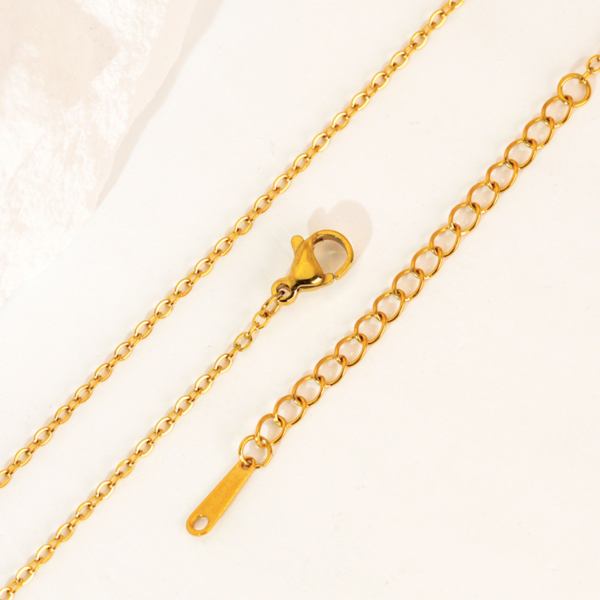 Gold-tone stainless steel cross chain with extender chain