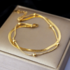 双层不锈钢扁蛇骨链+夹珠圆蛇链 (5) Wholesale gold double layer stainless steel anklet bracelet combining flat herringbone chain and satellite bead snake chain with extension.
