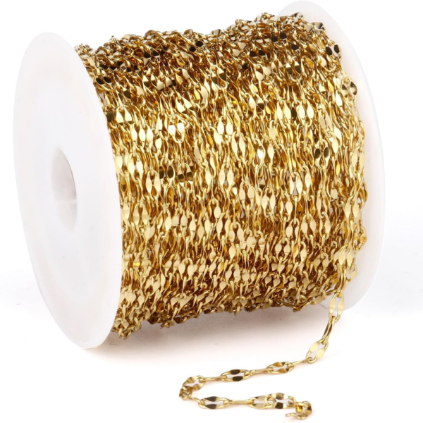 Wholesale luxury 18K gold plated stainless steel sequin link chain spool with a strand pulled out for custom necklace manufacturing inventory.