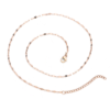A finished rose gold plated stainless steel sequin link chain necklace laid flat in a circular loop showing the lobster clasp and extender links.
