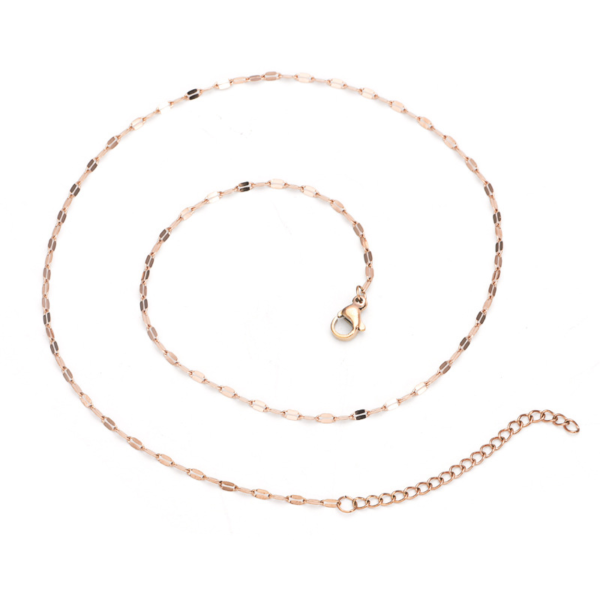 A finished rose gold plated stainless steel sequin link chain necklace laid flat in a circular loop showing the lobster clasp and extender links.