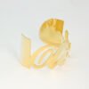 大字母手镯_0001_图层 6 Multi-angle technical layout of a custom gold stainless steel script lettering cuff bangle for international jewelry business catalog.