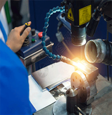 A laser welding machine is welding stainless steel jewelry.