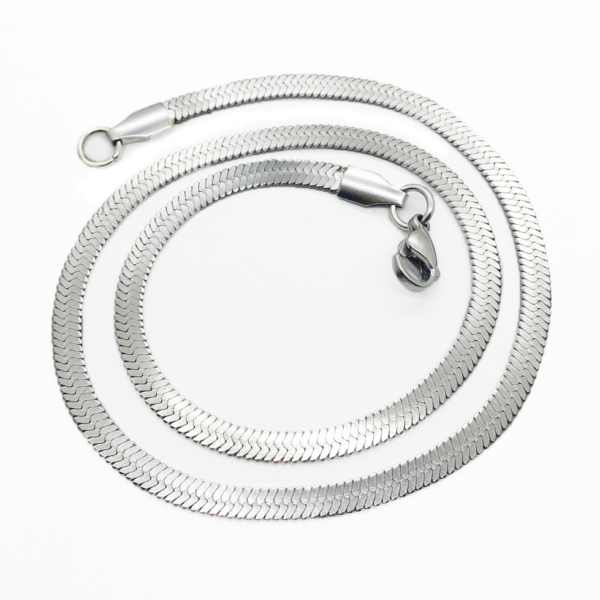扁蛇链 Flat snake chain (15) A finished silver stainless steel herringbone flat snake chain necklace with a lobster clasp arranged in a coiled layout on a clean white background.