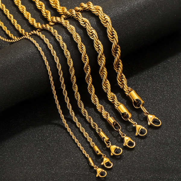 Wholesale gold stainless steel twisted rope chains of various thicknesses displayed elegantly on a dark textured background for B2B supplier.