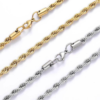 Close-up of gold and silver stainless steel twisted rope chain necklaces highlighting the cylindrical end caps and secure lobster clasps.