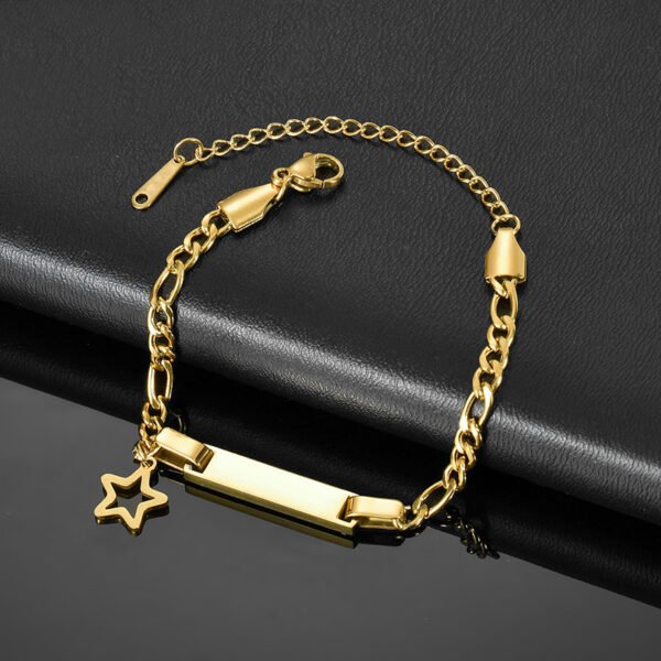 儿童刻字手链 (3) A blank finished gold stainless steel kids identity bar bracelet with an open star charm and adjustable extender links on a dark leather background.