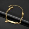 儿童刻字手链 (5) A blank polished gold stainless steel kids Figaro chain ID bracelet pre-fitted with a dainty solid heart charm for custom engraving vendor.