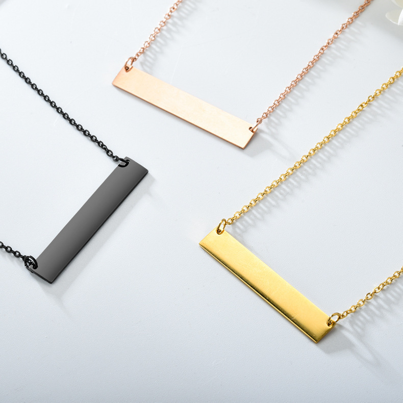 Wholesale finished stainless steel horizontal bar necklaces in matte black, rose gold, and 18K gold plated finishes displayed on a clean surface.