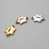 Wholesale blank 2-hole animal paw print link charms in gold, rose gold, and silver finishes arranged in a curve layout for jewelry making catalog.