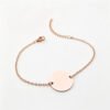 圆形18手链1000_0004_纯白图处理 (4) A blank finished rose gold plated stainless steel circular identity tag chain bracelet with a secure lobster clasp flatly laid on a clean backdrop.
