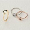圆形戒指定制_0001_dddddd Three round rings—in silver, gold, and rose gold—feature engraved portraits of people and pets, showcasing an engraving technique capable of highly faithful reproduction.
