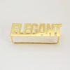 A finished 18K gold plated stainless steel two-finger ring custom laser-cut with the text "ELEGANT" displayed flat on a clean background for B2B catalog.