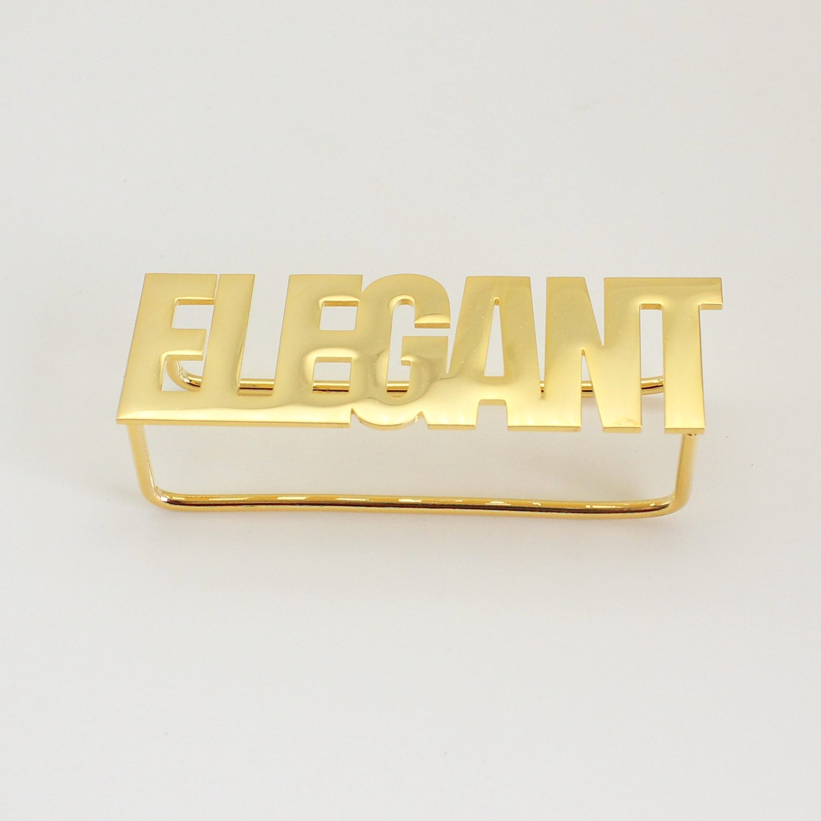 A finished 18K gold plated stainless steel two-finger ring custom laser-cut with the text "ELEGANT" displayed flat on a clean background for B2B catalog.
