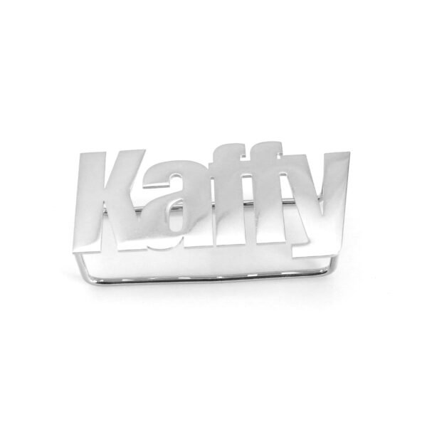 Wholesale finished silver stainless steel horizontal statement ring with laser cut out text "Kaffy" on a clean neutral backdrop.