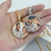 Wholesale finished silver and 18K gold plated stainless steel rhinestone photo pendant necklaces held in a hand custom printed with cat and couple pictures.