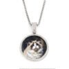 A finished silver stainless steel circular picture pendant necklace with an iced-out crystal rim custom printed with a high-definition pet cat photo on a white backdrop.