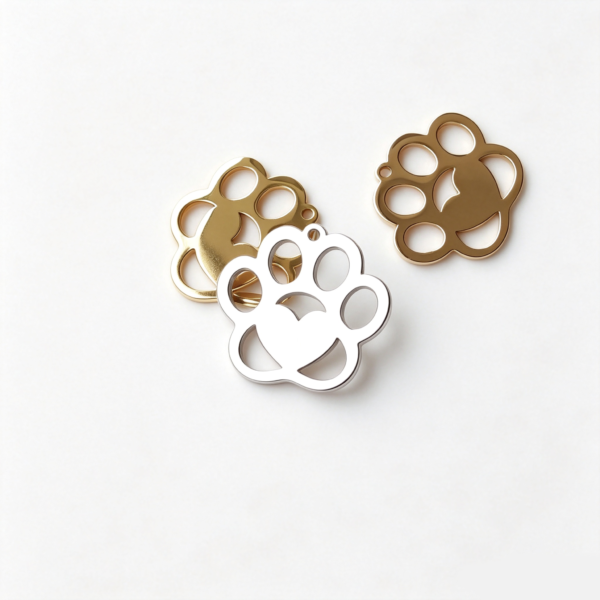 Parallel display of bulk customized stainless steel heart paw stampings in rose gold, silver, and gold finishes highlighting the high mirror polish.