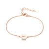 A minimalist rose gold-plated stainless steel bracelet with a mirror-polished finish, featuring a paw-print charm and a secure lobster clasp.