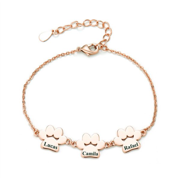 A minimalist rose gold-plated stainless steel bracelet with a mirror-polished finish, featuring three interconnected paw-print charms and a secure lobster clasp.