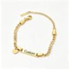 生成白底图 An isolated front view of a finished 18K gold plated stainless steel kids Figaro ID bracelet with a heart charm laser engraved with the word "Custom" on a white backdrop.