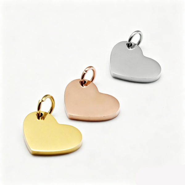生成白底图 Isolated view of wholesale custom gold, silver, and rose gold heart pendant blanks ready for personalized engraving for jewelry catalog.