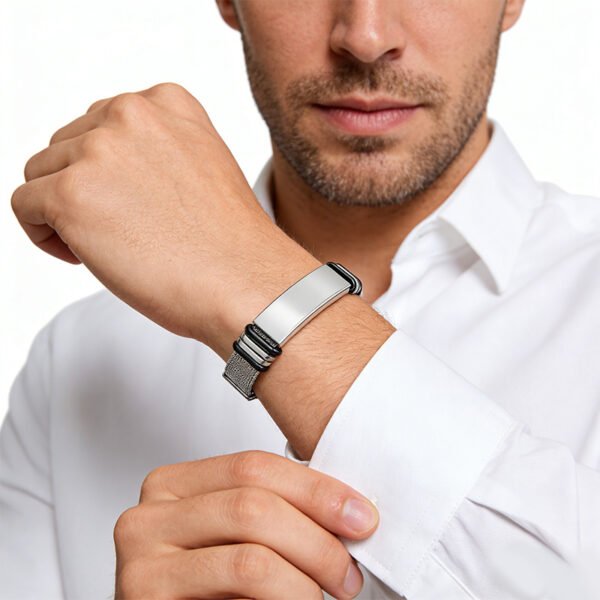Model wearing a sleek silver stainless steel watch strap style men's ID bracelet to showcase its dapper masculine aesthetic for custom jewelry store layout.