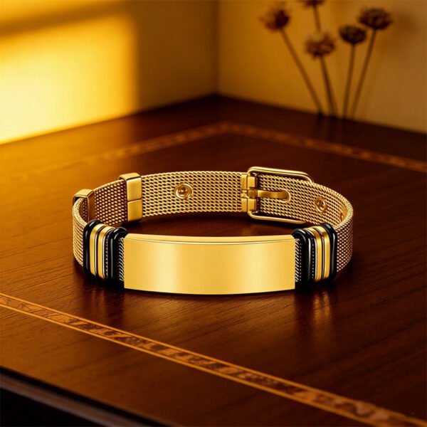 Men's ID bracelet with an all-gold stainless steel watch-style band, placed on a brown table.