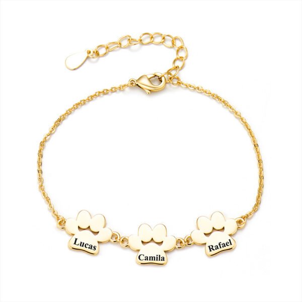 A minimalist gold stainless steel bracelet with a mirror-polished finish, featuring three interconnected paw-print charms and a secure lobster clasp.