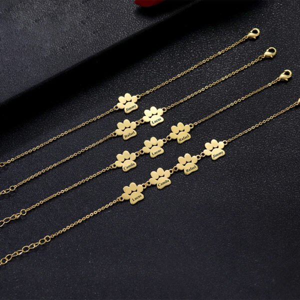 Technical layout photo showing wholesale personalized gold stainless steel animal paw chain bracelets arranged cleanly from 1 to 4 connected plates.