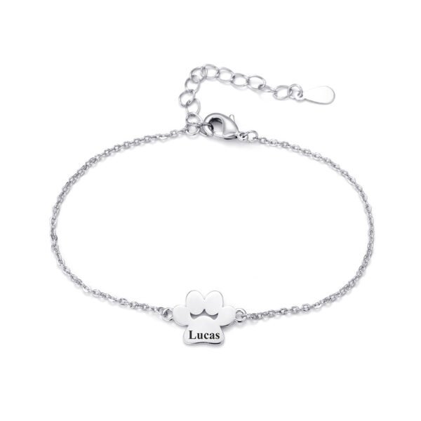 A minimalist, mirror-polished silver stainless steel bracelet featuring a paw-print charm and a secure lobster clasp.