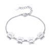 A minimalist, mirror-polished silver stainless steel bracelet featuring four interconnected paw-print charms and a secure lobster clasp.