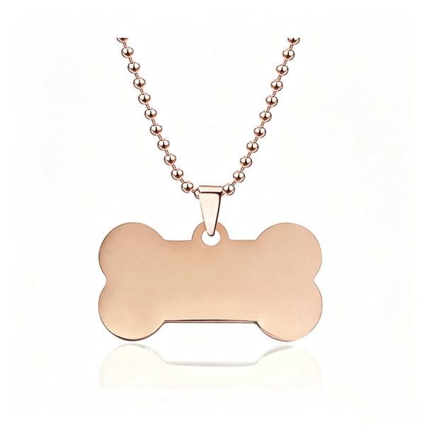 A finished rose gold plated stainless steel bone pendant necklace with a matching ball chain displayed on a clean white background for B2B supplier.