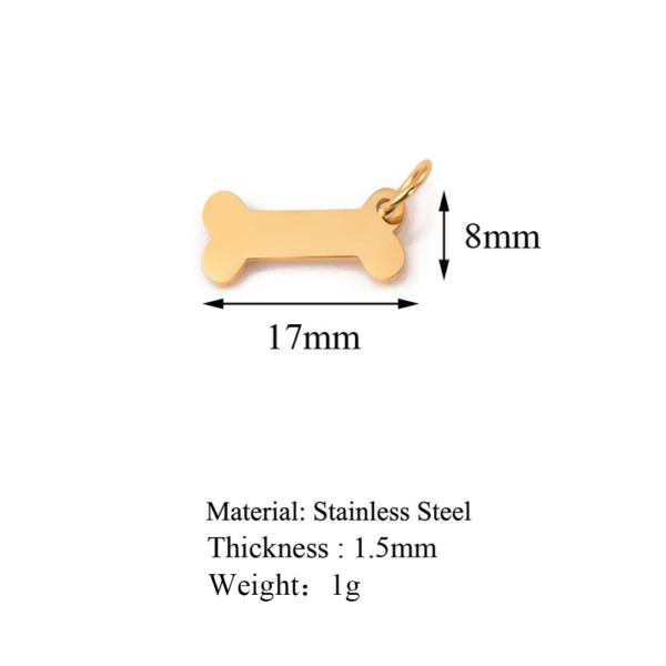 A technical product diagram of a gold stainless steel mini bone charm showing dimensions of 17mm width, 8mm height, 1.5mm thickness, and 1g weight.