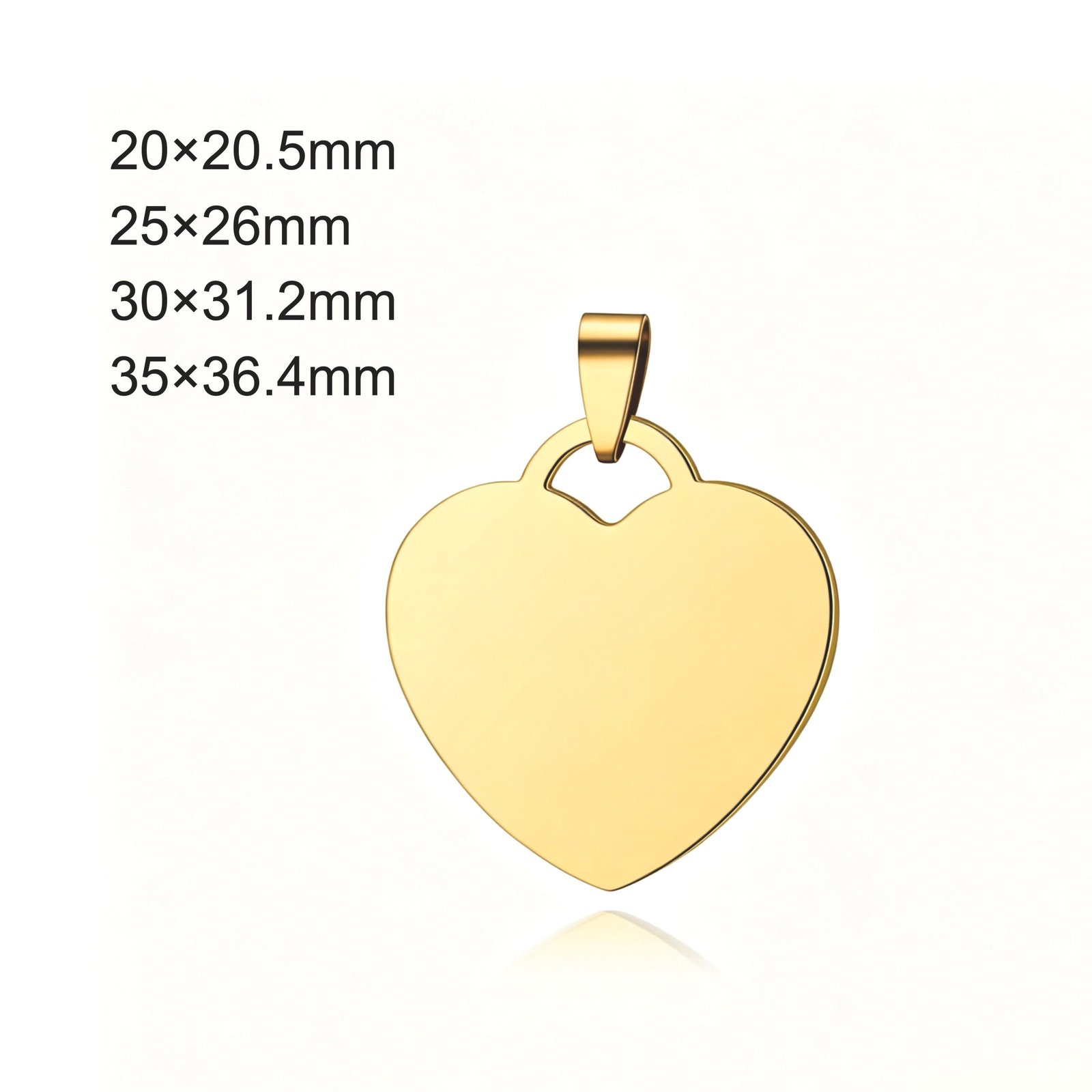 A close-up view of the front of a highly polished gold stainless steel heart-shaped blank pendant (with a top suspension loop) set against a white background with a subtle reflection; four different sizes are indicated in the top-left corner.