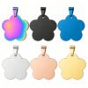 Six stainless steel flower-shaped tags with pendant bails displayed in two rows, showcasing rainbow anodized, matte black, royal blue, silver, rose gold, and gold finishes.