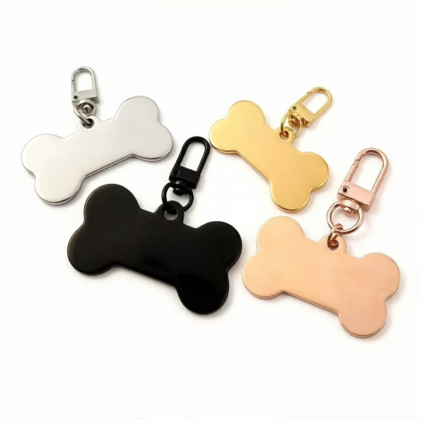 Polished stainless steel bone-shaped tags attached to matching color lobster claw clasps, shown in silver, black, gold, and rose gold.